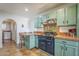 Bright kitchen with breakfast nook and view of laundry area at 1637 W University Dr, Mesa, AZ 85201