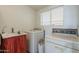 Convenient laundry area with sink, washer, and dryer at 1637 W University Dr, Mesa, AZ 85201