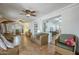 Bright living room showcasing tile flooring, arched doorway, and wicker furnishings at 1637 W University Dr, Mesa, AZ 85201