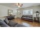 Comfortable living room with tile flooring, front door view, and decorative furnishings at 1637 W University Dr, Mesa, AZ 85201