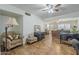 Living room featuring tile flooring, front entry, and cozy armchair seating at 1637 W University Dr, Mesa, AZ 85201