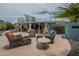 Inviting outdoor patio area with comfortable wicker furniture, perfect for entertaining and relaxing under the sky at 1637 W University Dr, Mesa, AZ 85201