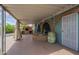 Covered patio features an outdoor kitchen, decorative brickwork, and tiled accents, creating a charming entertainment space at 1637 W University Dr, Mesa, AZ 85201