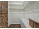 Spacious walk-in closet with ample shelving and built-in storage at 1637 W University Dr, Mesa, AZ 85201