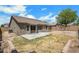 Overview of backyard showing patio, low retaining wall and access to home's windows and doors at 1669 E Santa Fiore St, San Tan Valley, AZ 85140
