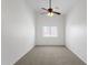 Neutral bedroom with a ceiling fan and window providing natural light at 1669 E Santa Fiore St, San Tan Valley, AZ 85140