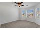 Bright bedroom with a ceiling fan and natural light from multiple windows at 1669 E Santa Fiore St, San Tan Valley, AZ 85140
