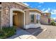 Inviting front entrance with stone accents and an outdoor hanging light fixture at 1669 E Santa Fiore St, San Tan Valley, AZ 85140