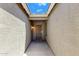 A welcoming home entrance featuring neutral walls, a security door and a hanging light fixture at 1669 E Santa Fiore St, San Tan Valley, AZ 85140