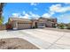 Well maintained single-story home with a two-car garage and a concrete driveway at 1669 E Santa Fiore St, San Tan Valley, AZ 85140