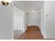 Bright hallway with tile floors, neutral walls, and classic white doors at 1669 E Santa Fiore St, San Tan Valley, AZ 85140