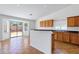 Bright eat-in kitchen area with earth tone floors, oak cabinets and backyard access at 1669 E Santa Fiore St, San Tan Valley, AZ 85140