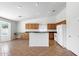 Bright eat-in kitchen area with earth tone floors, oak cabinets, white appliances at 1669 E Santa Fiore St, San Tan Valley, AZ 85140