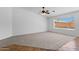 Spacious living room with neutral carpet and multiple windows at 1669 E Santa Fiore St, San Tan Valley, AZ 85140