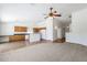 Open floor plan with carpeted living room and tiled eat-in kitchen at 1669 E Santa Fiore St, San Tan Valley, AZ 85140