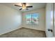 Cozy bedroom offers neutral walls and plush carpet. It also has a bright window with natural light at 17617 W Corrine Dr, Surprise, AZ 85388