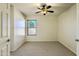 Bedroom featuring neutral carpet, ceiling fan, and natural light at 17617 W Corrine Dr, Surprise, AZ 85388