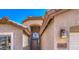 Inviting front entry with overhead light fixture and address number visible at 17617 W Corrine Dr, Surprise, AZ 85388