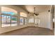 Spacious living room with arched windows offering plenty of natural light at 17617 W Corrine Dr, Surprise, AZ 85388