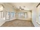 Inviting living room with plush carpet, neutral paint, ceiling fan, and natural light at 17617 W Corrine Dr, Surprise, AZ 85388