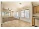 Open concept living area featuring tile flooring and neutral colors with natural light from nearby windows at 17617 W Corrine Dr, Surprise, AZ 85388
