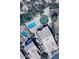 Aerial view of a backyard with a pool, waterslide, and trampoline at 1766 N Channing --, Mesa, AZ 85207