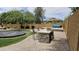 Outdoor grill area with granite countertop, stone base and bar seating, perfect for entertaining at 1766 N Channing --, Mesa, AZ 85207