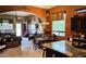 Warm dining room view into living room, showcasing an open floor plan and ample natural light at 1766 N Channing --, Mesa, AZ 85207