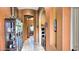 Elegant hallway with arched doorways, decorative niches, and tile flooring, showcasing architectural details at 1766 N Channing --, Mesa, AZ 85207