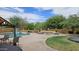 Inviting backyard with pool, patio, fire pit, grill and lush landscape, great for entertaining at 1766 N Channing --, Mesa, AZ 85207