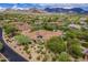 Aerial view of a desert home with private backyard landscaping and mountain views at 19947 N 94Th Way, Scottsdale, AZ 85255