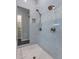 Modern bathroom shower featuring dual shower heads and decorative tile work at 19947 N 94Th Way, Scottsdale, AZ 85255