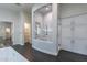 Bathroom features a modern shower with glass enclosure and white cabinets for ample storage at 19947 N 94Th Way, Scottsdale, AZ 85255