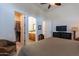 Bedroom featuring a view of the ensuite bathroom and walk-in closet at 19947 N 94Th Way, Scottsdale, AZ 85255