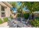 Private outdoor courtyard with Adirondack chairs surrounding a coffee table at 19947 N 94Th Way, Scottsdale, AZ 85255
