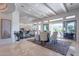 Well-lit dining area flows into other living spaces and is highlighted by large windows and travertine floors at 19947 N 94Th Way, Scottsdale, AZ 85255