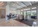 Bright dining area with a glass table, white chairs, exposed beams, and sliding glass doors to the backyard at 19947 N 94Th Way, Scottsdale, AZ 85255