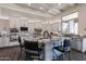 Kitchen island features marble countertops, white cabinets, and stainless steel appliances at 19947 N 94Th Way, Scottsdale, AZ 85255