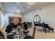 Spacious living room with a piano, dark velvet seating, chandeliers, and formal dining set at 19947 N 94Th Way, Scottsdale, AZ 85255