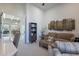 Bright living room with a neutral palette, comfortable sofa, and access to an outdoor space at 19947 N 94Th Way, Scottsdale, AZ 85255