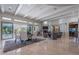 Open living space boasts high ceilings, fireplace, stone accents, and seamless indoor-outdoor flow at 19947 N 94Th Way, Scottsdale, AZ 85255