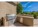 Outdoor kitchen with stainless steel grill and built-in counter space, perfect for entertaining at 19947 N 94Th Way, Scottsdale, AZ 85255