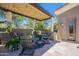 Cozy covered patio featuring stylish seating and decor, perfect for outdoor entertaining at 19947 N 94Th Way, Scottsdale, AZ 85255
