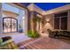 A comfortable patio space with brick pavers and potted plants for a relaxing setting at 19947 N 94Th Way, Scottsdale, AZ 85255