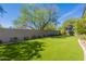 A private backyard putting green offers a fun recreational space for golf enthusiasts to practice their short game at 19947 N 94Th Way, Scottsdale, AZ 85255