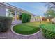 A well-maintained backyard putting green with flag markers for practicing golf in a private setting at 19947 N 94Th Way, Scottsdale, AZ 85255