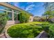 Backyard putting green, perfect for practicing your short game, complements this desert home at 19947 N 94Th Way, Scottsdale, AZ 85255
