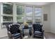 Sitting area offers lots of natural light through large windows and comfortable seating at 19947 N 94Th Way, Scottsdale, AZ 85255
