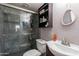 Updated bathroom with a glass shower, modern sink, and stylish shelving, providing a clean and inviting space at 2022 W Aster Dr, Phoenix, AZ 85029
