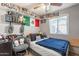 Bedroom with bed and shelving, offering ample storage space for toys and collectibles at 2022 W Aster Dr, Phoenix, AZ 85029